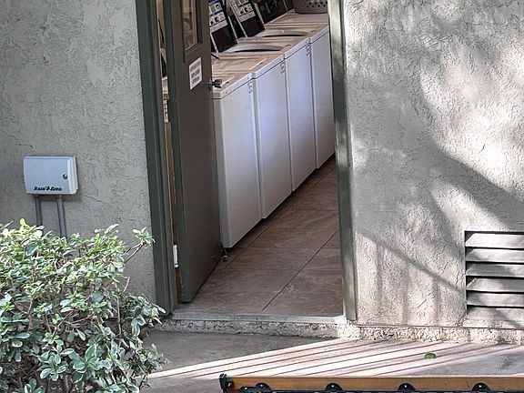 Laundry facility steps from the unit