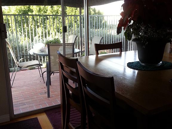 Dining area, just to the right of living room. Sliding doors to patio that overlooks golf course