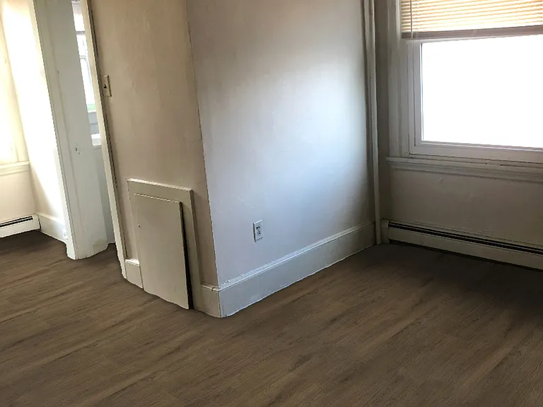 Bedroom with two windows, two large closets, and bathroom
