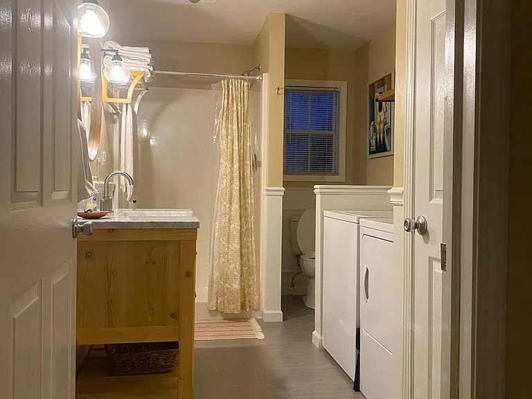 Main floor remodeled bathroom with washer and dryer and additional closet space