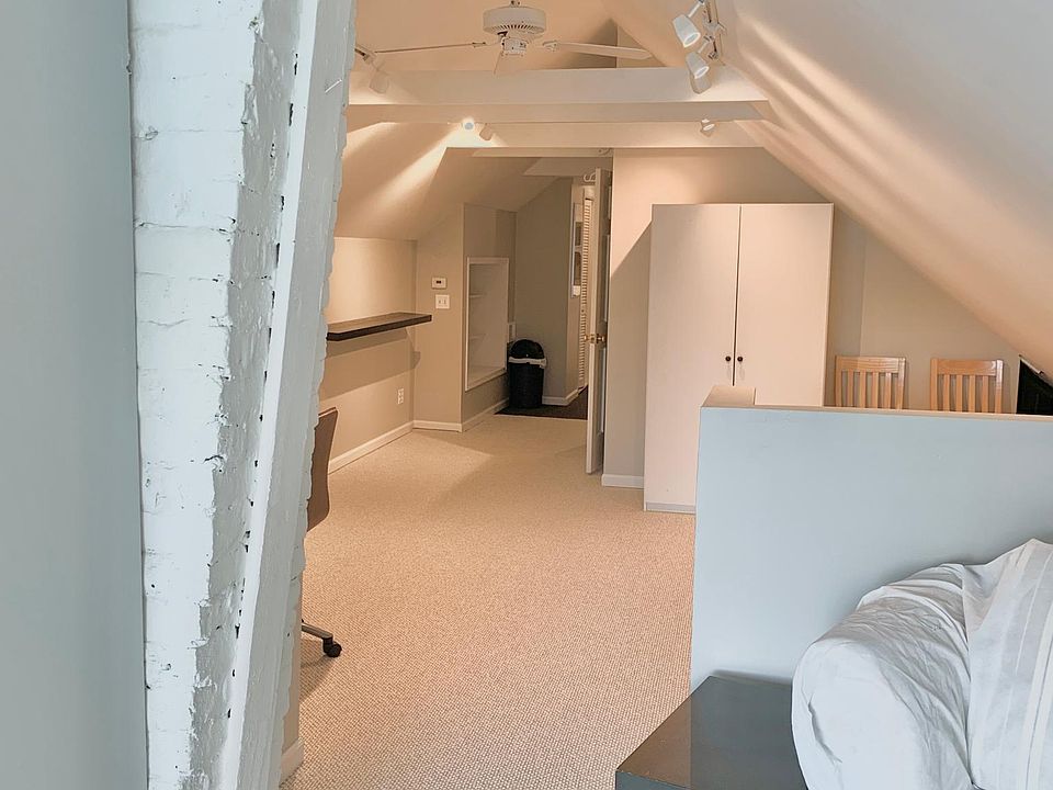 View of space from front living area, not including bathroom or bedroom. Lots of head space. Armoir