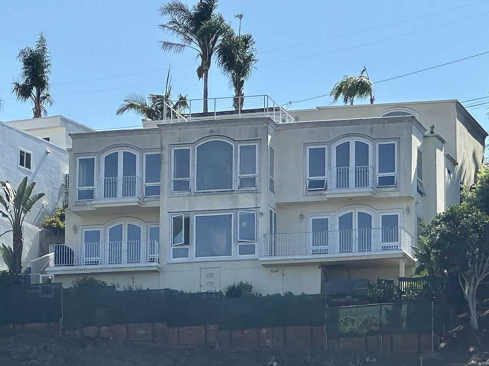 Experience elevated coastal living in this architecturally stunning residence, just steps from the shoreline. Thoughtfully designed for refined comfort, seamless flow, and panoramic beauty_where luxury meets laid-back elegance.