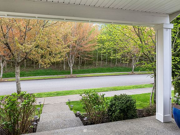 Enjoy tranquil greenbelt views from the front of the home.