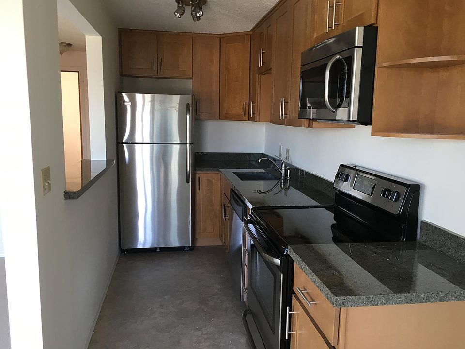 Updated kitchen with granite counters, new cabinets, and dishwasher