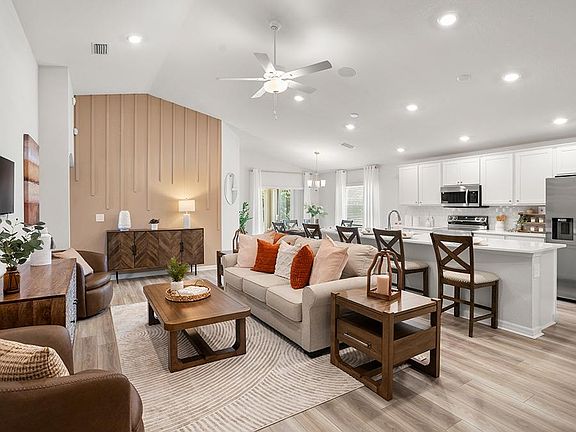 This popular 1,715 sq. ft. home plan includes a sunny open-concept layout - Parker by Highland Homes