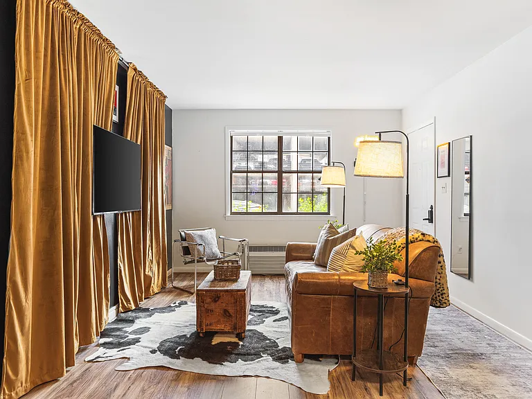 Cozy living room with a smart TV and a sleeper sofa. No stairs in this condo and located on the ground level, for easy access.