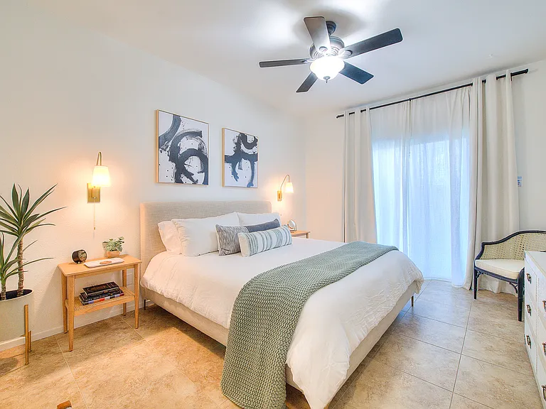 Primary bedroom with sliding doors to back patio