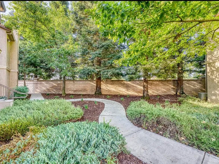 Beautifully landscaped entrance walkway to condo.
