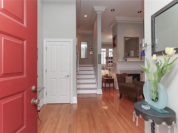 Inviting formal foyer with hardwood floors