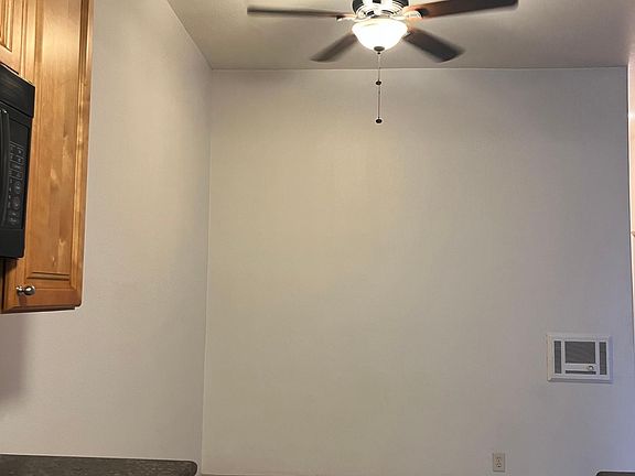 Open Kitchen with dining area. Top floor bright sun lit room with vaulted ceilings.