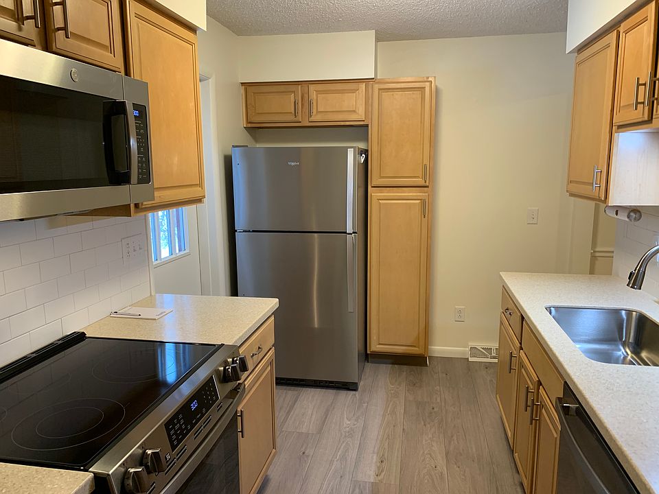 Kitchen with brand new stainless steel appliances.