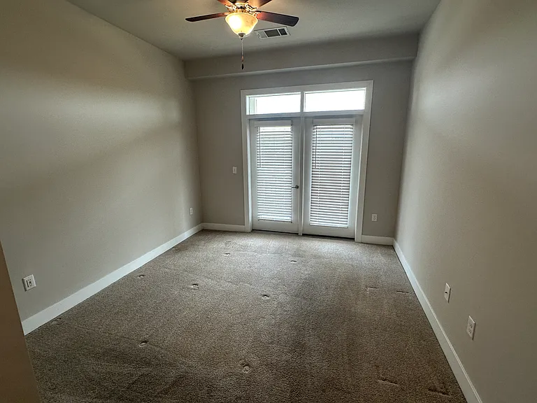 Primary bedroom with balcony access