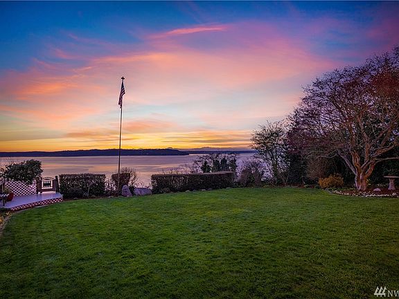 Enjoy 60 feet of high bank waterfront and a backyard that boasts a main floor deck and covered patio.