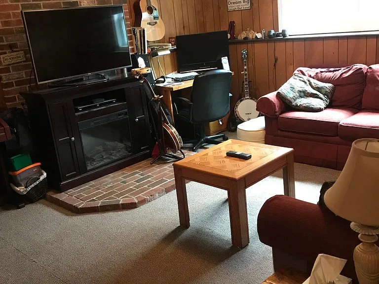 Another angle of family room, showing hearth.