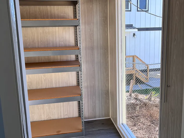 Extra storage room off laundry.