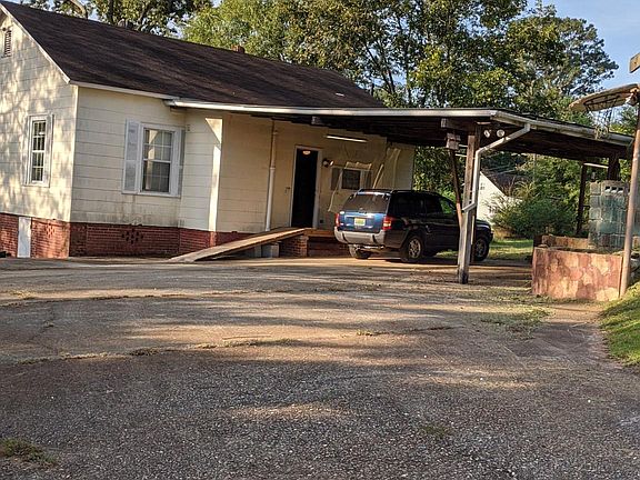 Carport on back of house. Wheelchair ramp.