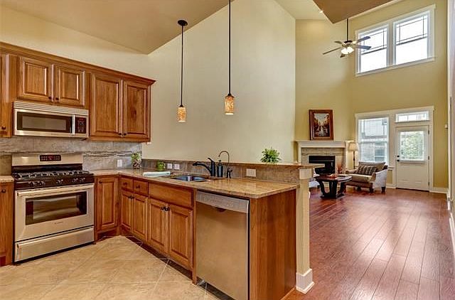 Soaring, two-story vaulted ceilings in living and dining area.
