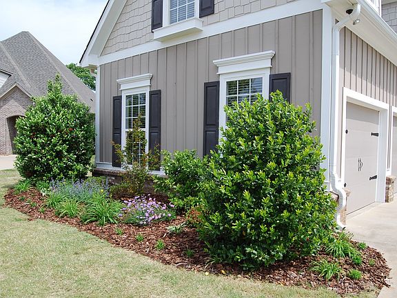 Landscaping is done, fence is in, outside freshly painted!