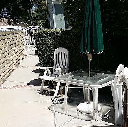 Private gate that leads to street. Use of this outdoor area is primarily yours to use and decorate. Comes with patio table and chairs.