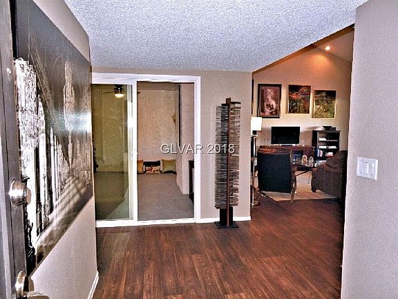 View as you enter the property. To the right is living room, dining room and kitchen.  Straight ahead is what I'm calling the De
