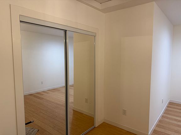 closet with mirror doors