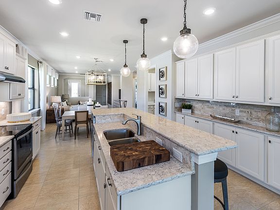 Model Representation Additional view of kitchen overlooking living spaces, great for entertaining