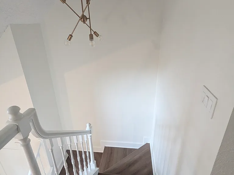Standing in loft looking downstairs.