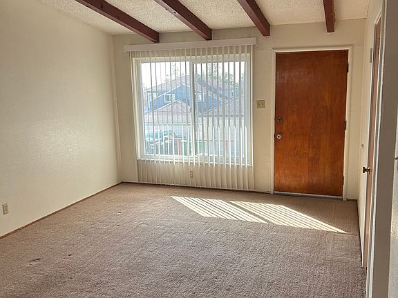 Large picture window and front door in living room