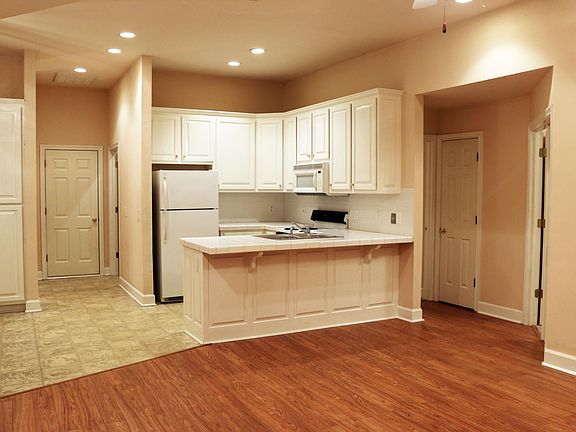 Custom-built solid wood cabinets throughout