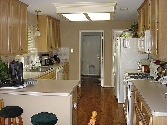 Comfortable laminate floors abound ... kitchen, breakfast room, dining room, and living area..... Look like Wood!