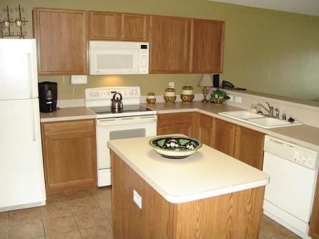 KITCHEN OPENS TO LIVING AREA
