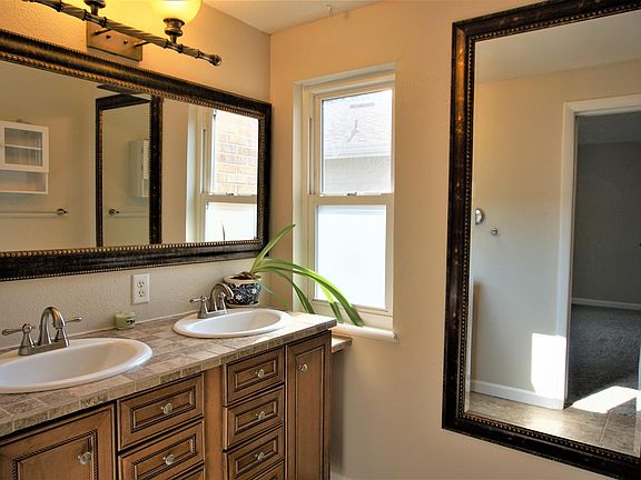 Primary bathroom with dual vanities