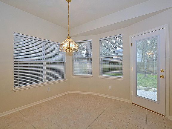 Informal dining area opens to a peaceful and quiet backyard