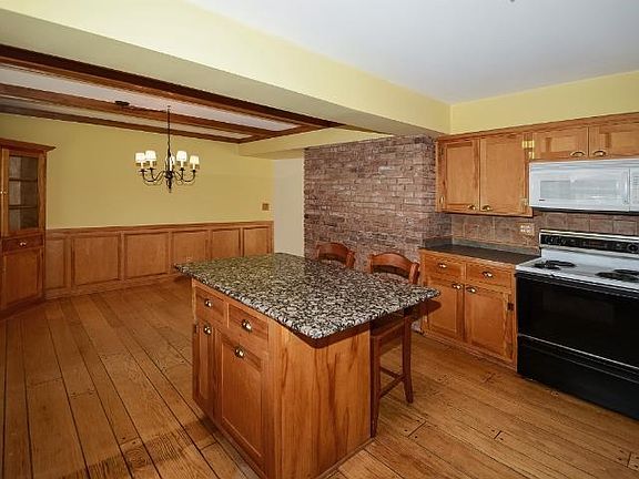 Beautiful birch cabinets and granite center island.  No shortage of space in this kitchen!