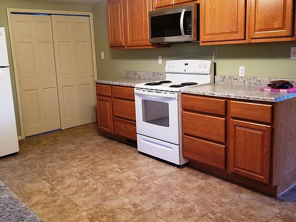 Kitchen, facing utility area behind closet doors