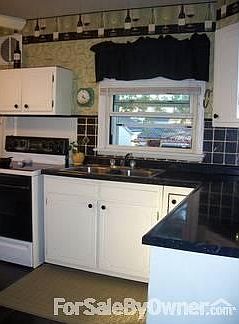 Looking into kitchen from hallway.