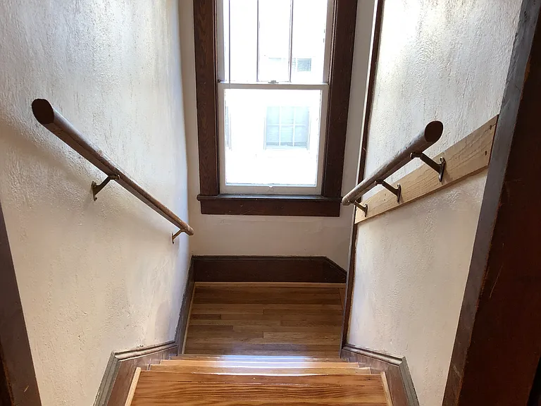 Hallway looking down stairs to landing