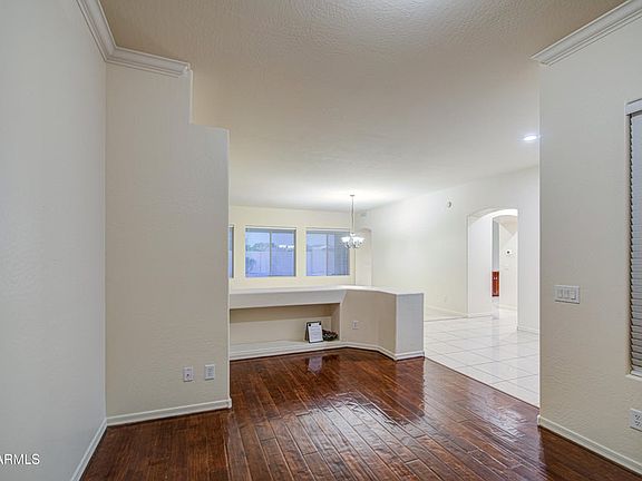 Den in front of house