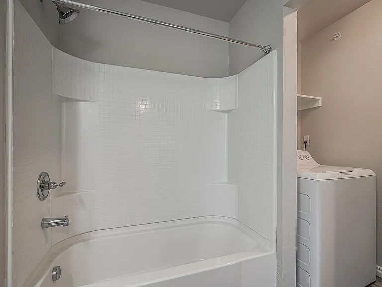 Experience convenience with this stylish bathroom and laundry combo, designed for modern living.