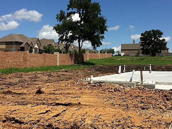 There will be a covered patio and outdoor kitchen in the backyard upon completion!