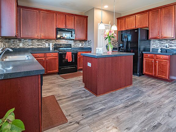 Upgraded kitchen with backsplash and waterproof floor
