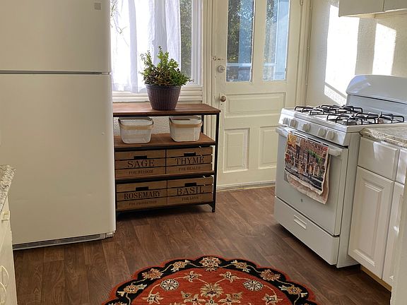 Kitchen with separate rear exit to elevated back sun deck.