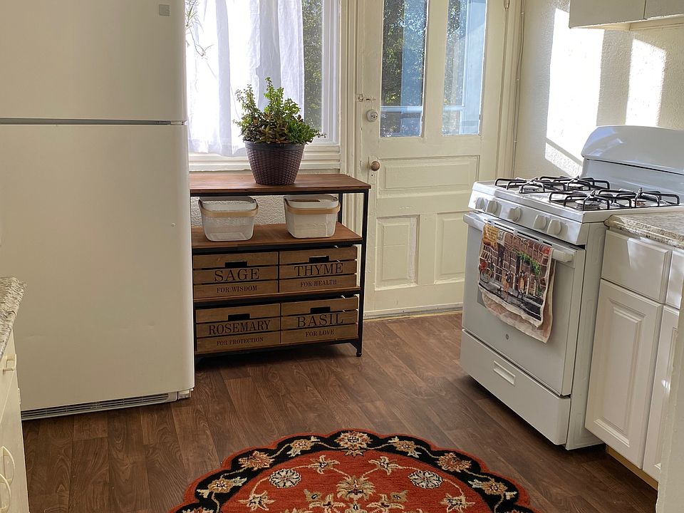 Kitchen with separate rear exit to elevated back sun deck.