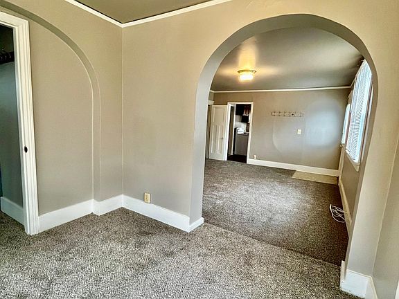 Den/dining area off of living room and primary bedroom