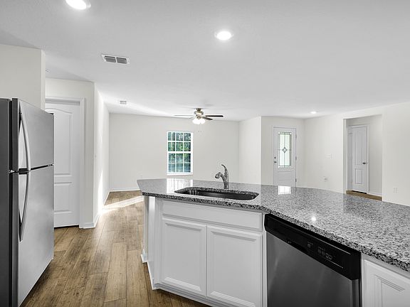 The kitchen comes chef-ready with stainless steel appliances