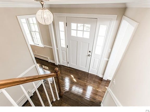 Kitchen opens up beautifully into house with the crown and chair molding.