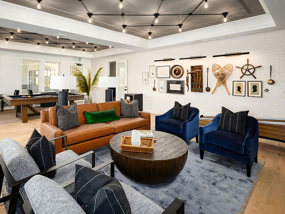 Intimate and comfy social seating area with a game-themed backdrop
