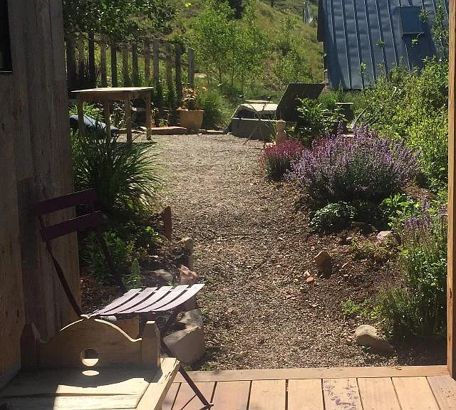 Lower Deck steps onto lovely flower garden.