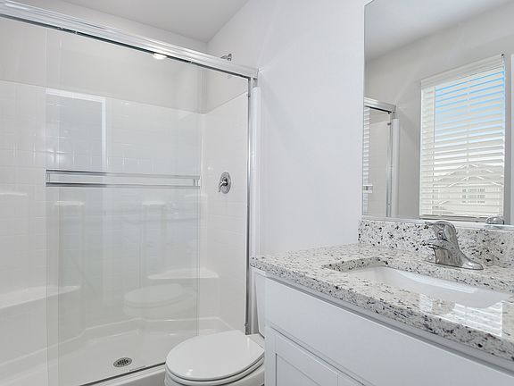 The master bathroom has a step in shower.
