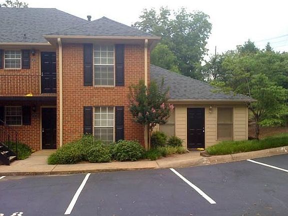 Lower black door_.brick building